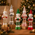 Five-piece Christmas snowman figurine set in gold, silver, green, pink and red