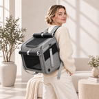 Woman wearing a gray convertible pet carrier as a backpack