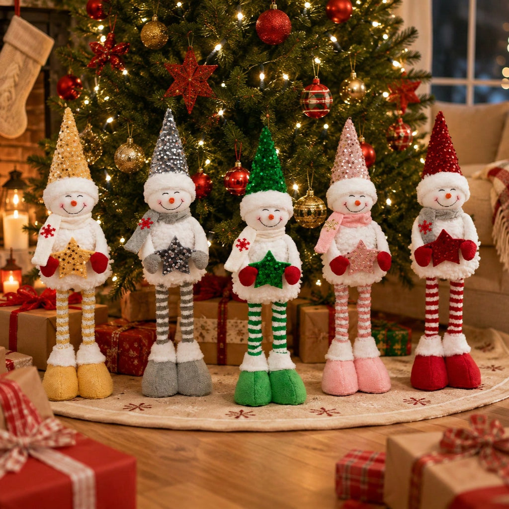 Tall five-piece Christmas snowman decoration set beside a Christmas tree